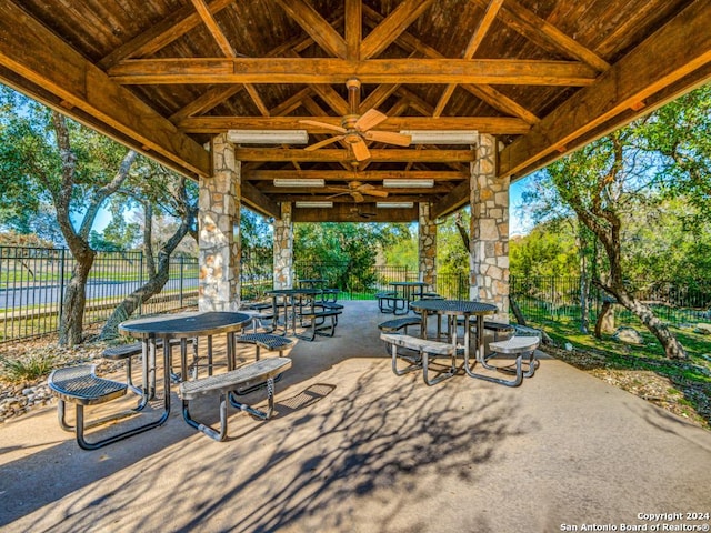 view of patio / terrace with outdoor dining space, a gazebo, and fence