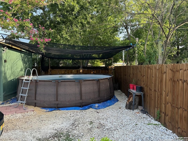 view of yard featuring a fenced in pool