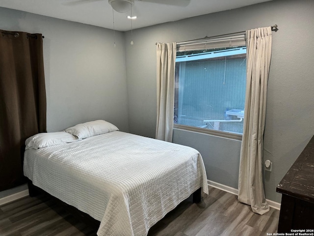 bedroom featuring ceiling fan and wood-type flooring