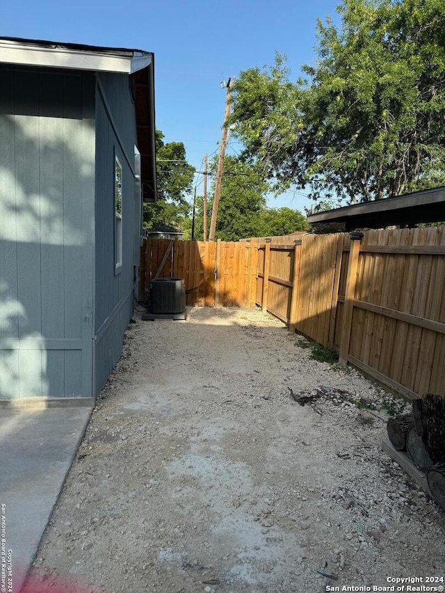 view of side of property with cooling unit