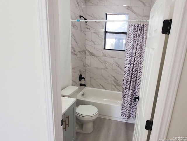 full bathroom with vanity, wood-type flooring, shower / bathtub combination with curtain, and toilet