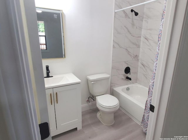 full bathroom with hardwood / wood-style floors, shower / bathtub combination with curtain, toilet, and vanity