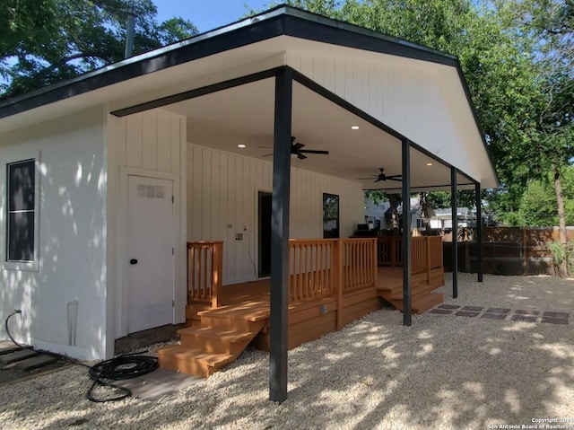 exterior space with ceiling fan