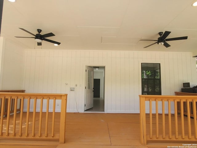 interior space with a deck and ceiling fan