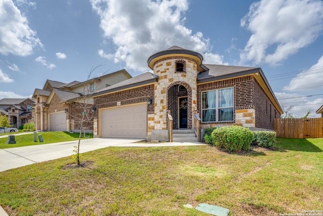 view of front facade with a front yard and a garage