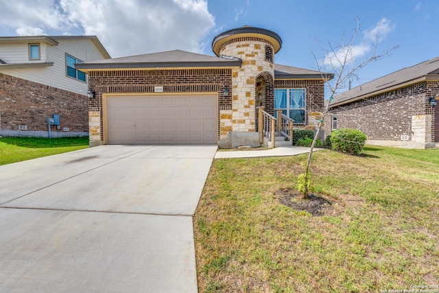 view of front of home with a garage and a front lawn