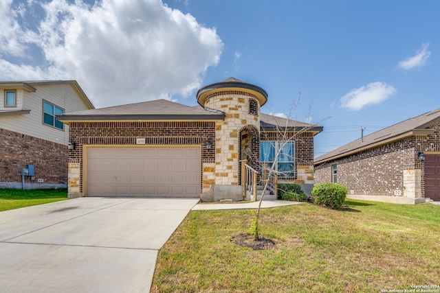 view of front facade with a front yard and a garage