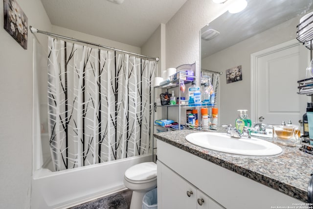 full bathroom featuring shower / bath combo, toilet, and vanity