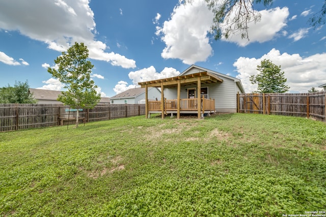 view of yard with a deck