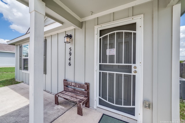 entrance to property featuring central AC unit