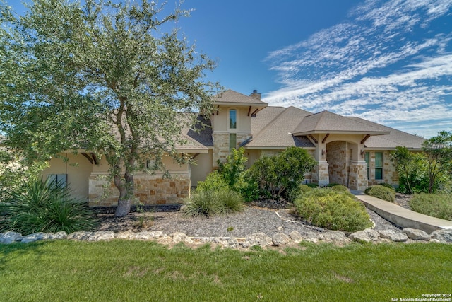 mediterranean / spanish-style house featuring a front yard