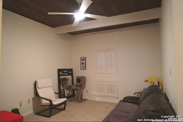 living room featuring wood ceiling, ceiling fan, and carpet flooring