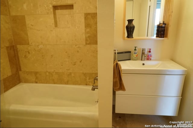 bathroom with vanity, a bath, and tile patterned floors