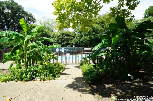 view of yard featuring a community pool