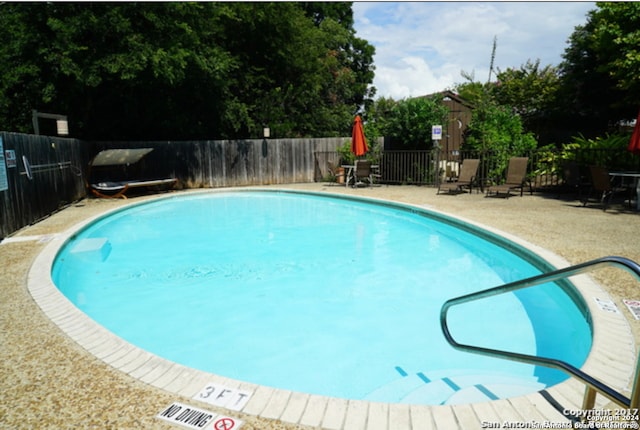 view of pool featuring a patio area