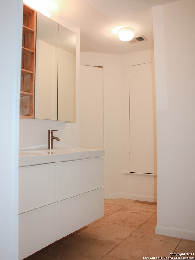 bathroom featuring tile patterned floors and vanity