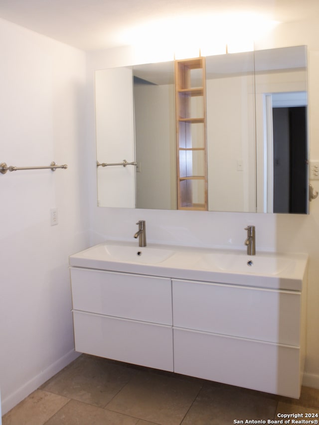 bathroom featuring double vanity and tile patterned floors