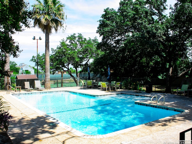 view of swimming pool with a patio