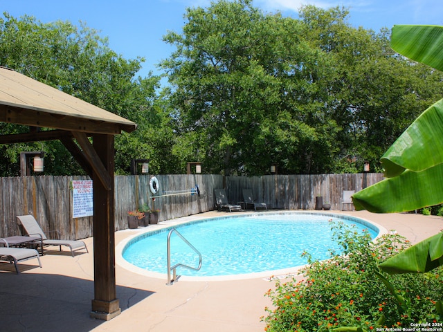 view of pool featuring a gazebo and a patio area