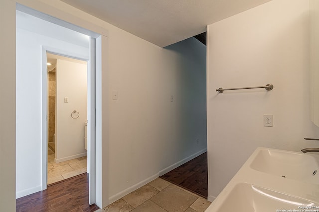 bathroom with sink and wood-type flooring