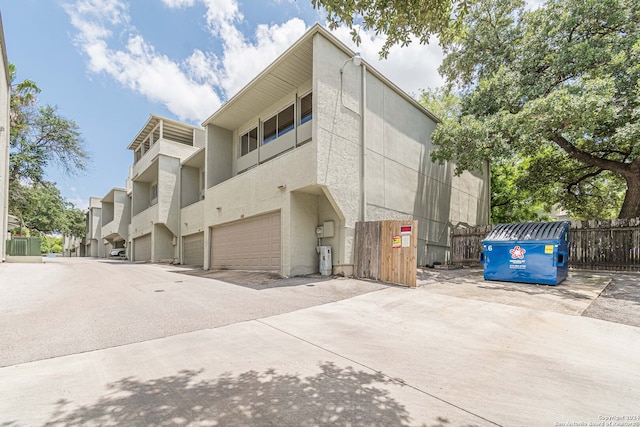 view of property exterior with a garage