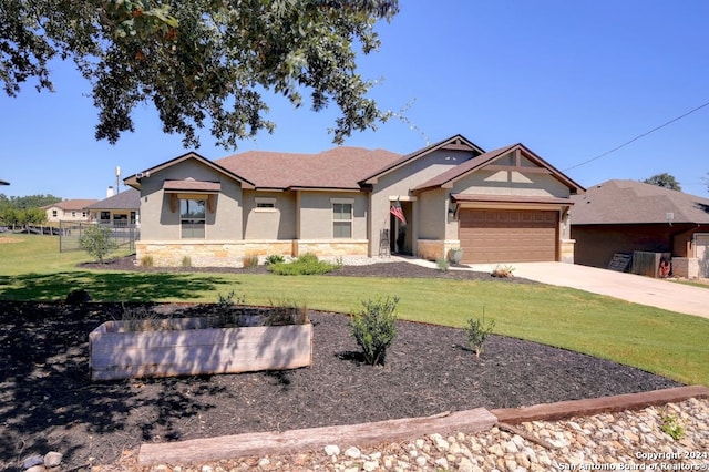 view of front of house with a front lawn and a garage