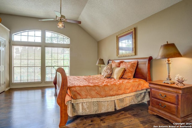 bedroom with dark hardwood / wood-style flooring, a textured ceiling, ceiling fan, and vaulted ceiling