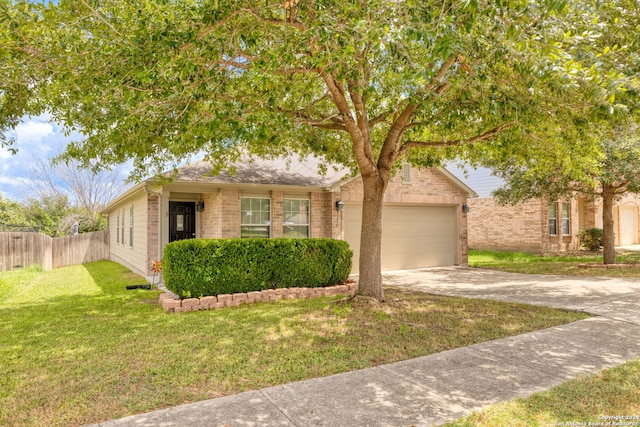 view of front facade with a garage and a front lawn