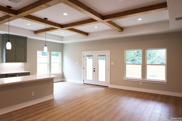 kitchen featuring decorative light fixtures, green cabinets, light hardwood / wood-style flooring, and coffered ceiling