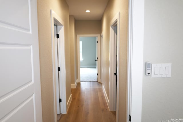 hallway with light wood-type flooring