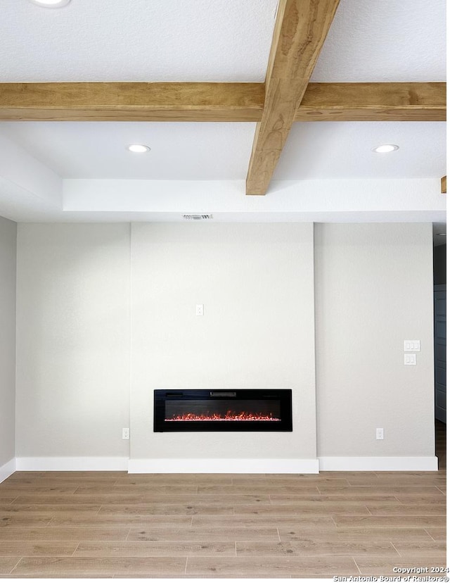 details with beam ceiling and wood-type flooring