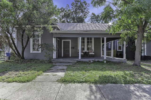 bungalow-style house featuring covered porch