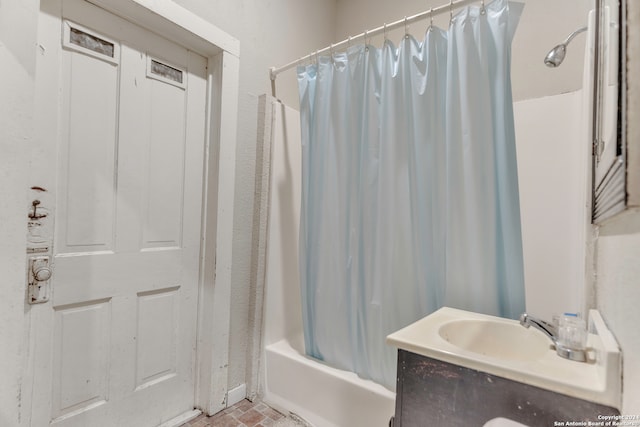 bathroom with shower / bath combination with curtain and vanity