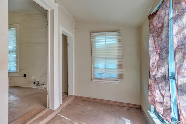 doorway to outside featuring a healthy amount of sunlight and lofted ceiling