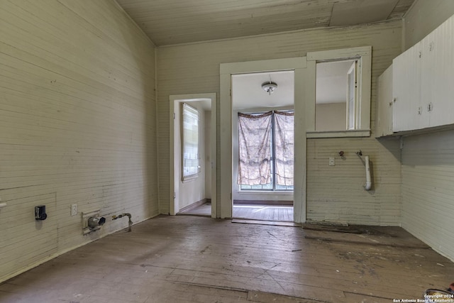laundry area featuring wood-type flooring and laundry area