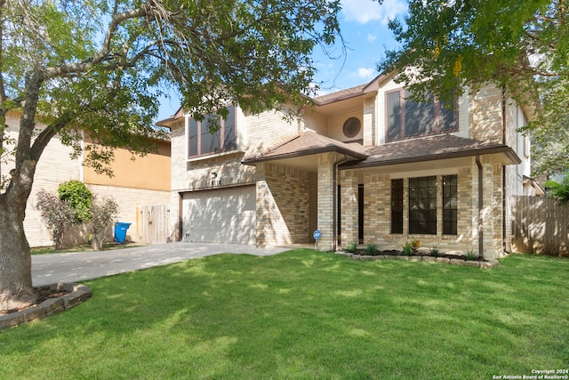 view of front of home featuring a garage and a front lawn