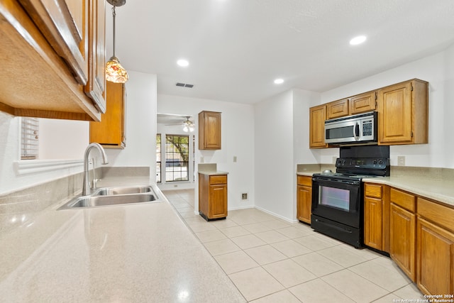 kitchen with sink, hanging light fixtures, light tile patterned floors, ceiling fan, and black range with electric stovetop