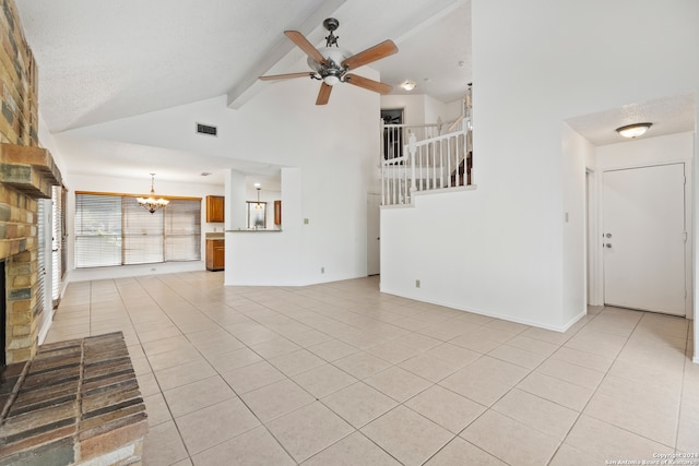 unfurnished living room with light tile patterned flooring, ceiling fan with notable chandelier, high vaulted ceiling, beamed ceiling, and a brick fireplace