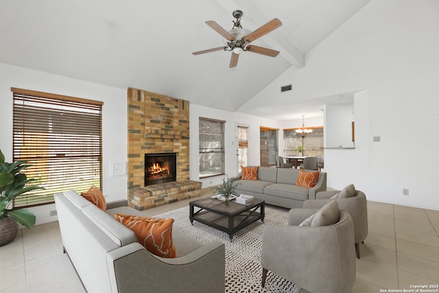 tiled living room featuring a brick fireplace, ceiling fan with notable chandelier, high vaulted ceiling, and beamed ceiling