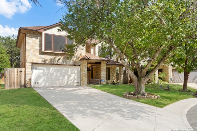 view of front facade with a garage and a front yard