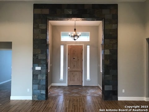 entrance foyer featuring an inviting chandelier