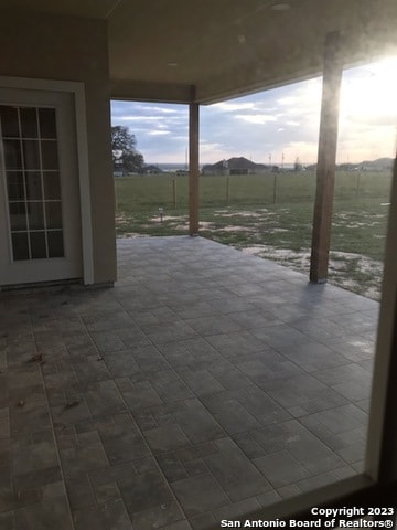 view of patio / terrace with a rural view