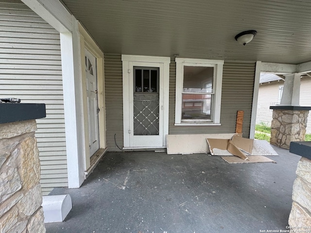 doorway to property featuring covered porch