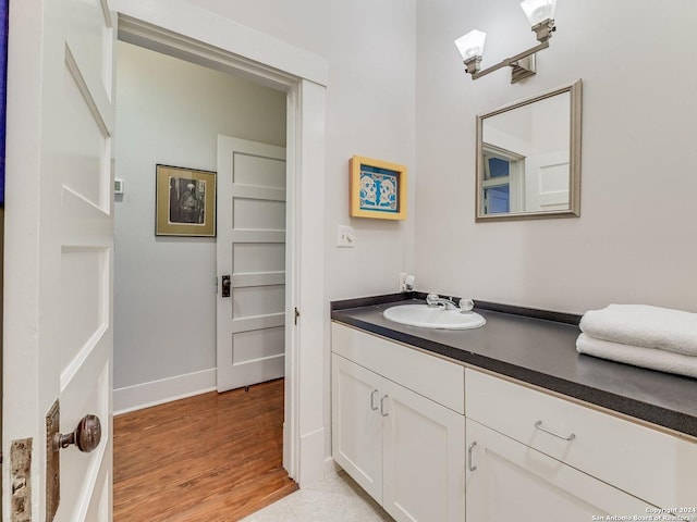 bathroom featuring hardwood / wood-style floors and vanity