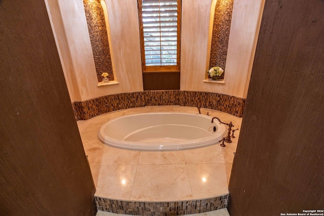 bathroom with tiled bath