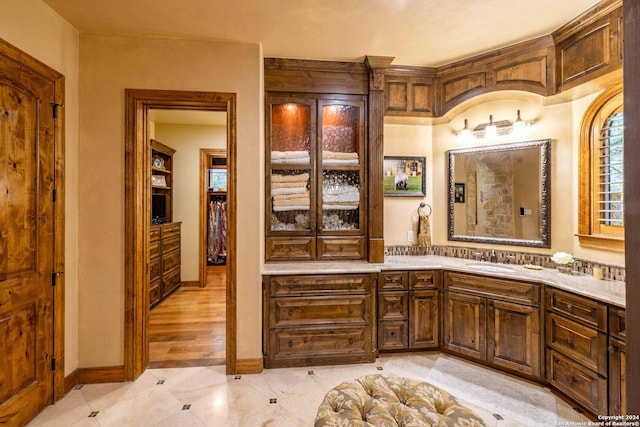 bathroom with tile patterned flooring and vanity