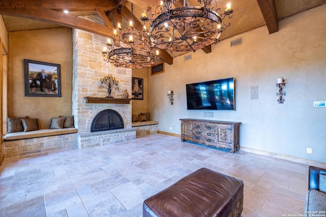 unfurnished living room with a fireplace, beam ceiling, and high vaulted ceiling