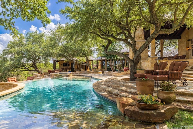 view of swimming pool with a patio and a gazebo