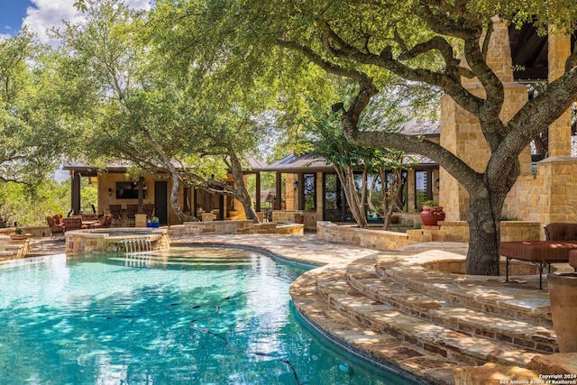 view of pool with a gazebo, a patio area, and an in ground hot tub