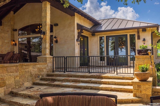 property entrance featuring french doors